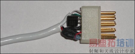 Figure 2. DB9 connector with embedded TO92 1-Wire device before injection molding.